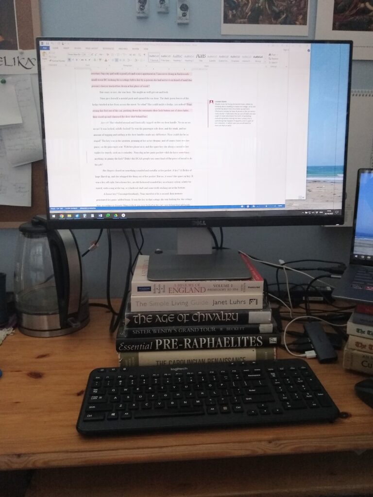 computer with manuscript in editing stage displayed on it